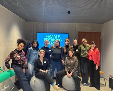 Workshop participants posing as a group, relaxed, confident, and happy.”