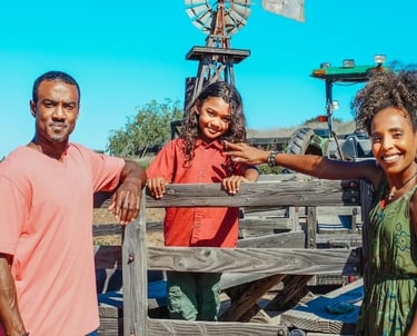 young African American family at a farm