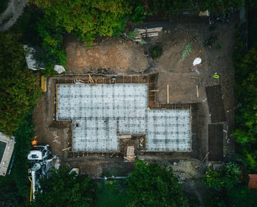 Aerial view of residential concrete foundation under construction in Manitoba