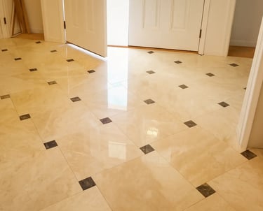 professionally installed polished marble tiles accented with contrasting dark inlays.