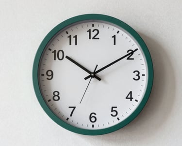 A minimalist wall clock on a plain paper white wall. The hands are at a precise angle. Focus on time and clarity. Forest green accent.