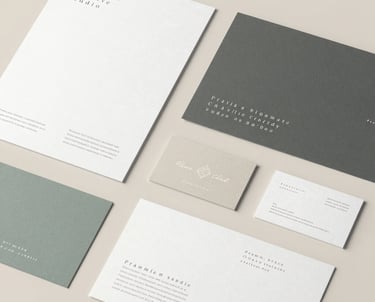 Minimalist workspace with branding sketches and color palettes on a clean desk.