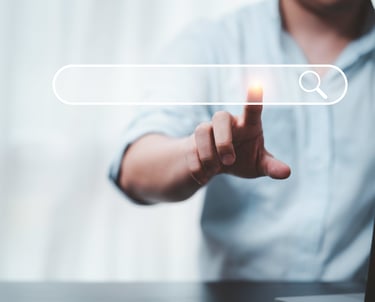 A person pointing at a digital search bar icon to represent SEO and online data browsing.