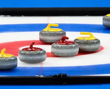 Image of curling stones on house