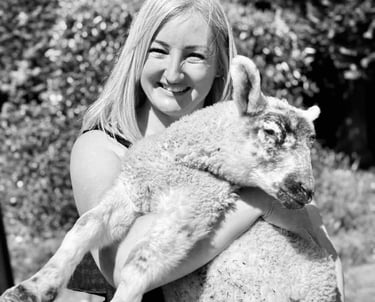Laura holding a sheep