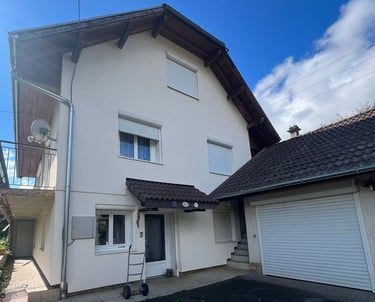 a house with a garage door and a garage door