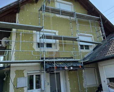 a house with a scafaffe on a scaffolded up to