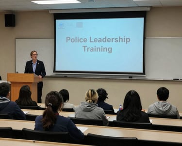 A confident police officer leading a training session with attentive participants.