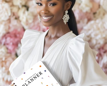 A bride-to-be holding My Wedding Goals Planner smiling