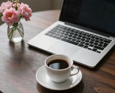 An elegant desk setup with a modern laptop, a cup of fine coffee, and a small vase of pink flowers. Suggesting luxury professional action.