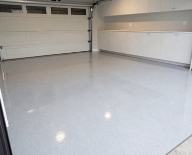 Decorative flake epoxy garage floor coating in a modern residential garage