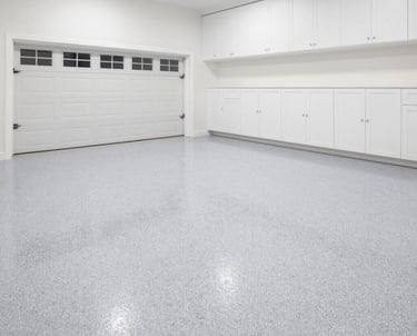 Decorative flake epoxy garage floor coating installed in a residential garage in Celina Texas