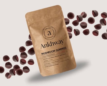Ankhway mushroom gummies in a brown pouch surrounded by floating raspberry functional mushroom supplements.