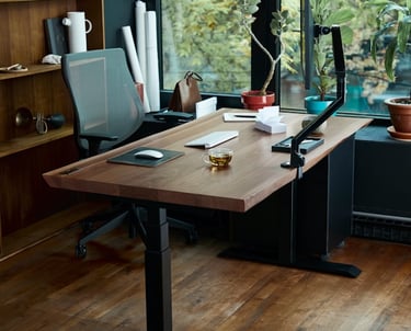a desk with a laptop and a laptop on a wooden desk