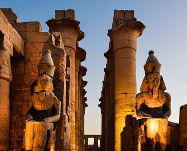 In the shadows of giants at Luxor Temple in Egypt