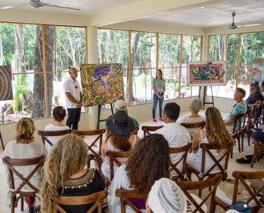 Artist Ismael Venegas presents Conscious Art therapy, colorful abstract paintings to an audience in