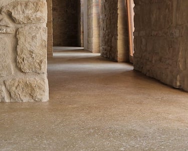 shiny rammed earth floor in a stone house
