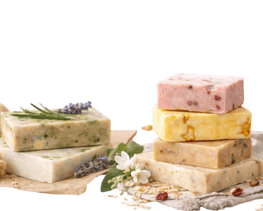 Handmade organic soap bars stacked with natural herbs, lavender, and oats for skincare.