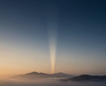 Soft, swirling mist over a calm horizon at dawn, evoking a sense of new beginnings and inner clarity.