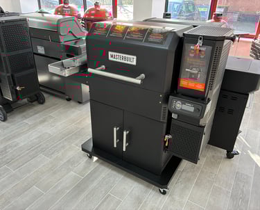 A black Masterbuilt Gravity Series digital charcoal grill and smoker on display in a showroom.