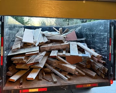pile of wood in a trailer