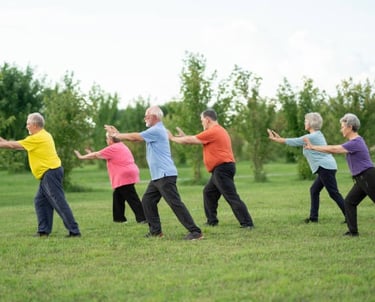 A group adults practicing Tai Chi outdoors for fun and wellness
