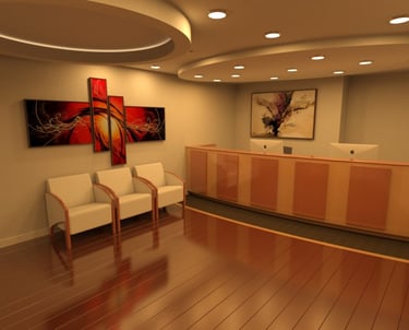 Modern lobby with maple wood flooring, curved reception desk, split-level ceiling, recessed lights.