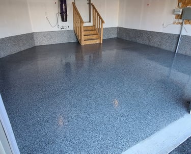 Polyaspartic garage floor with decorative flake finish in residential garage
