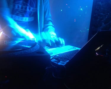 Vibrant neon-lit DJ turntable in Garden Club Alcudia
