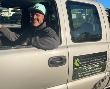Owner of Treasure Coast lawn care company in Sebastian FL driving truck