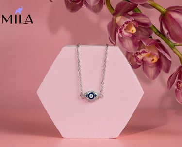 a necklace with a evil eye on it
