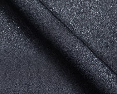 Macro shot of high-quality fabric textures with a subtle shimmer, suggesting premium quality and attention to detail, East Asian / Japanese style.