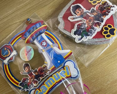 Custom Paw Patrol cake topper and decorations featuring Ryder and pups for a 4th birthday party.