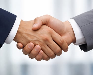 Close-up of a professional business handshake representing a successful deal, partnership, or agreement.