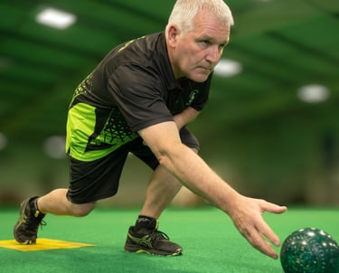 Bowler releasing the bowl on an indoor mat