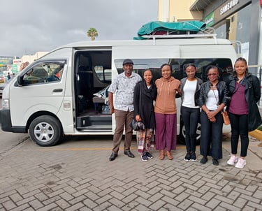 A group of travellers with Vanna Ventures for car hire for a group corporate trip.