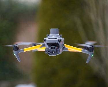 Professional DJI Mavic 3 thermal drone with thermal camera hovering outdoors for aerial inspection.