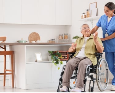 A caregiver pushing an elderly woman patient in her wheel chair