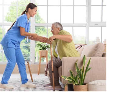 Caregiver helping a female patient to stand up