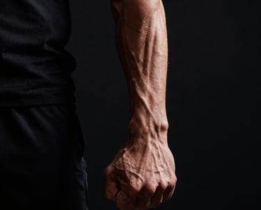 Woman walking on beach at sunset
