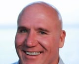 a man in a blue shirt and a white shirt