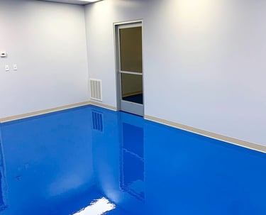 Solid color epoxy floor in commercial room