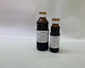 große und kleine braune Öl-Flasche: Hanföl