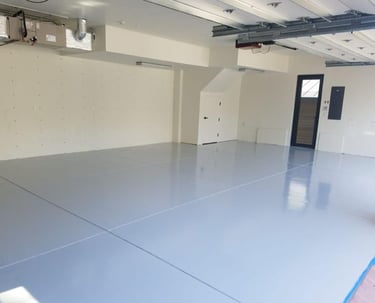Solid color epoxy floor in 3 car garage