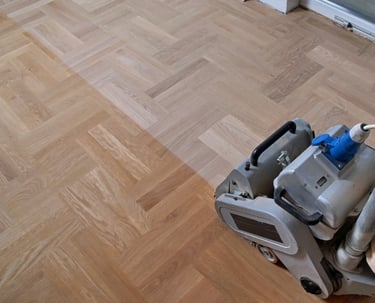 Sanding hardwood floors with belt sander