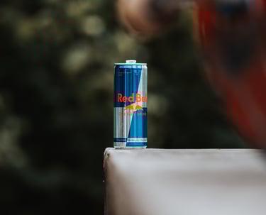 a can of soda on a skateboard
