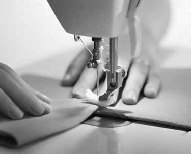 Close-up of precision sewing process at King Fly's manufacturing facility.