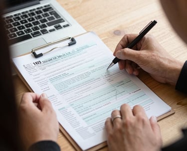 Professional consultant reviewing tax documents in modern office.