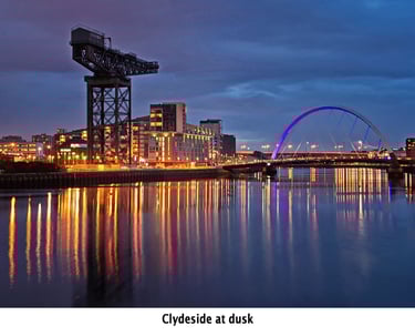 the iconic River Clyde at dusk, featuring a remaining crane and the millennium bridge
