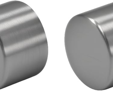 two large round metal knobs with a white background